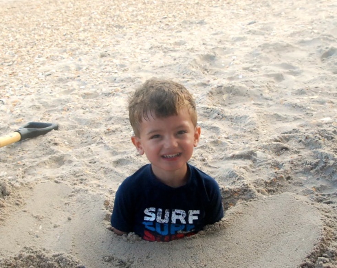 Charlie was so excited when Jason buried him in the sand!