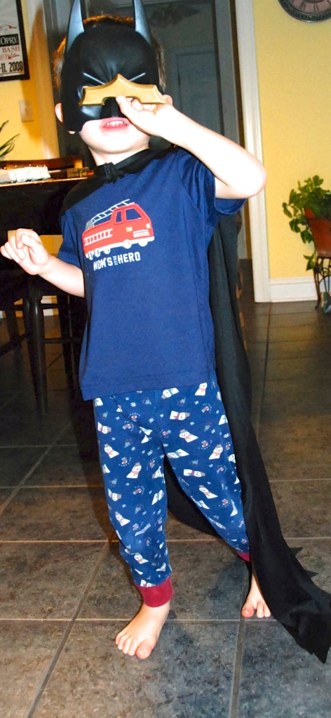 This photo is from March, and these pajamas are now too small for the Chachinator.  His batman costume, however, is not!  He still loves everything Batman, and has added several other costumes to his collection.